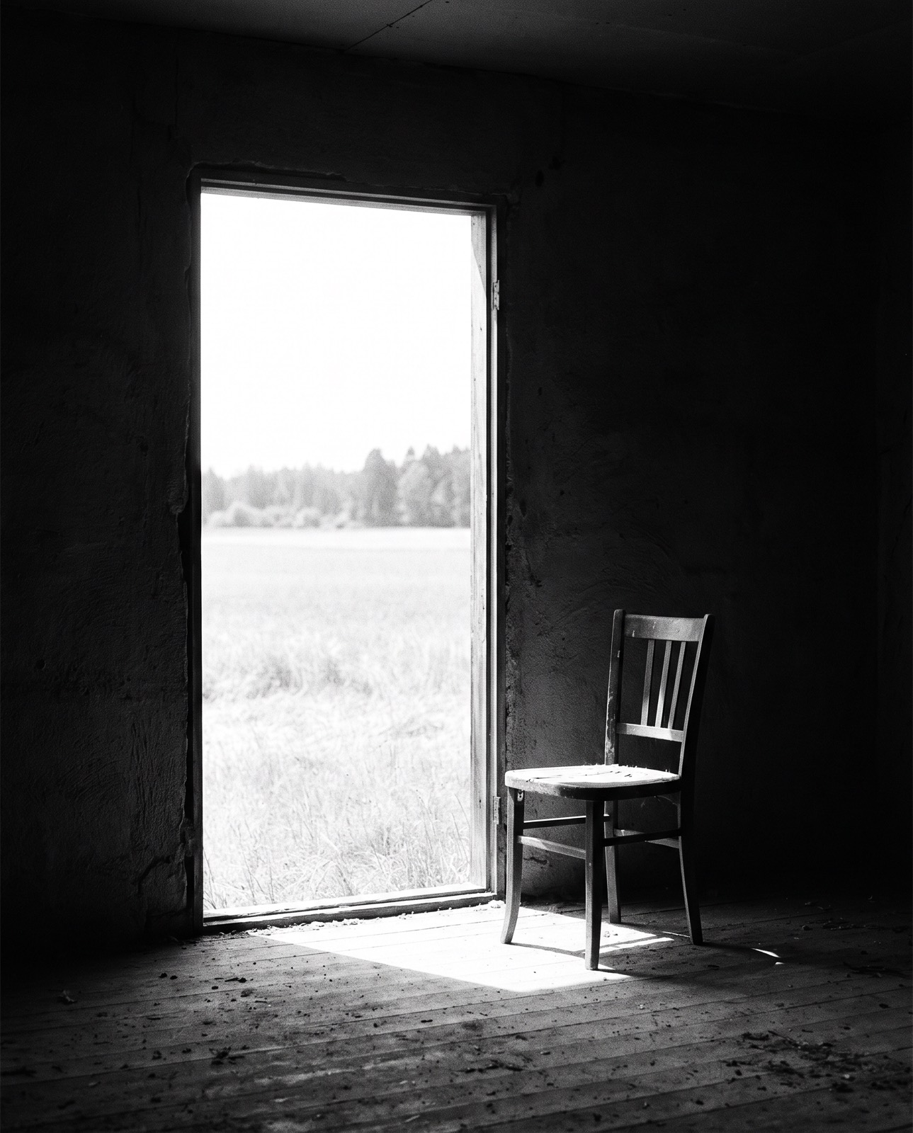 A bright doorway seen from a dark room